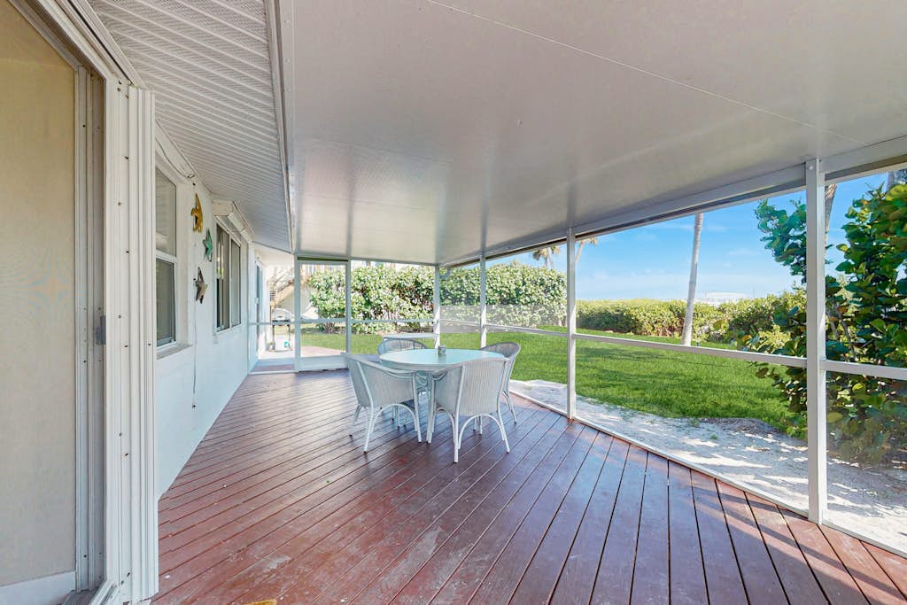 Bayfront oasis with screened lanai, views, private dock, & beach access nearby