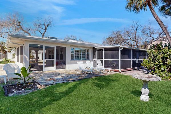 Bayfront oasis with screened lanai, views, private dock, & beach access nearby