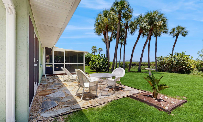 Bayfront oasis with screened lanai, views, private dock, & beach access nearby