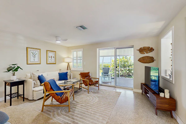 Bayfront oasis with screened lanai, views, private dock, & beach access nearby