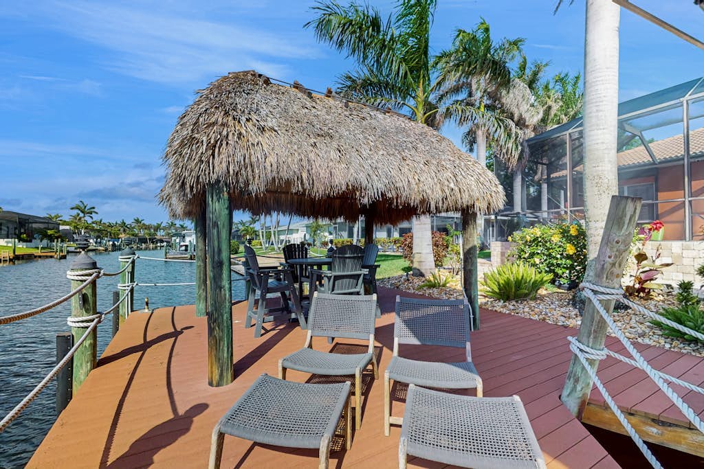 Waterfront home with private pool, lanai, dock, & tiki hut