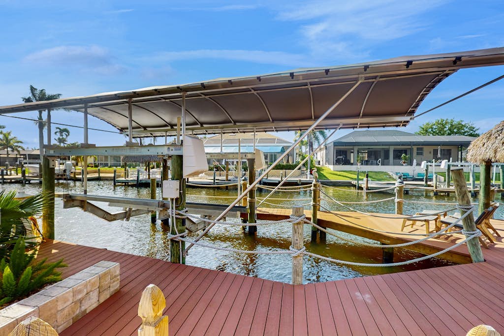 Waterfront home with private pool, lanai, dock, & tiki hut