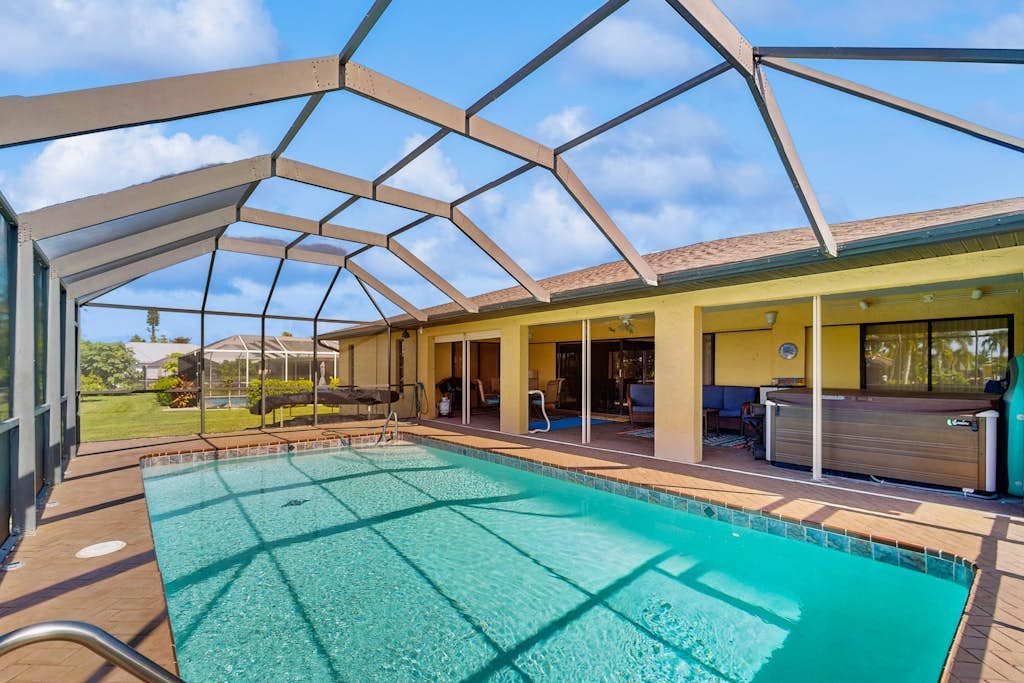 Canal front home with private pool, lanai, and washer and dryer.
