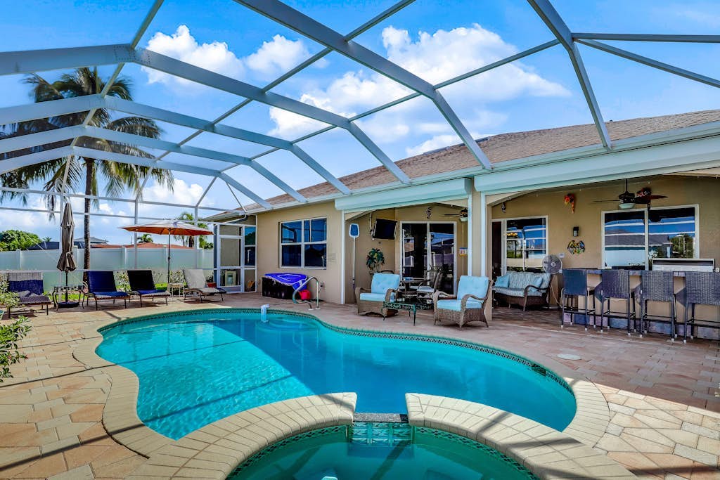 Dog-friendly home on canal with heated pool, spas, central AC, & washer/dryer