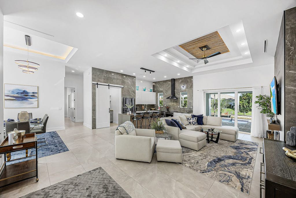 Sophisticated and serene home on waterway, sparkling pool, fireplace, W/D & AC