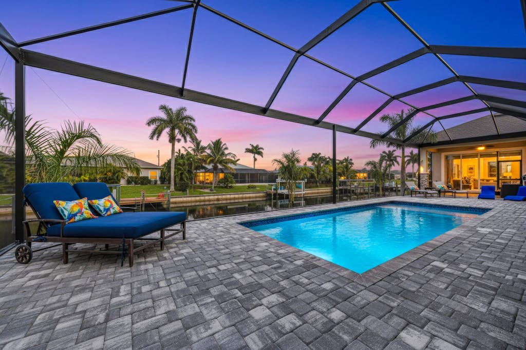 Sophisticated and serene home on waterway, sparkling pool, fireplace, W/D & AC