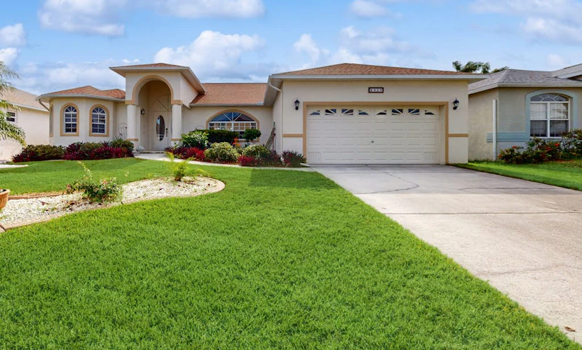 Spacious Lakefront Home with a Screened-In Pool in Exclusive Community