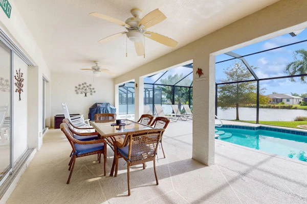 Spacious Lakefront Home with a Screened-In Pool in Exclusive Community