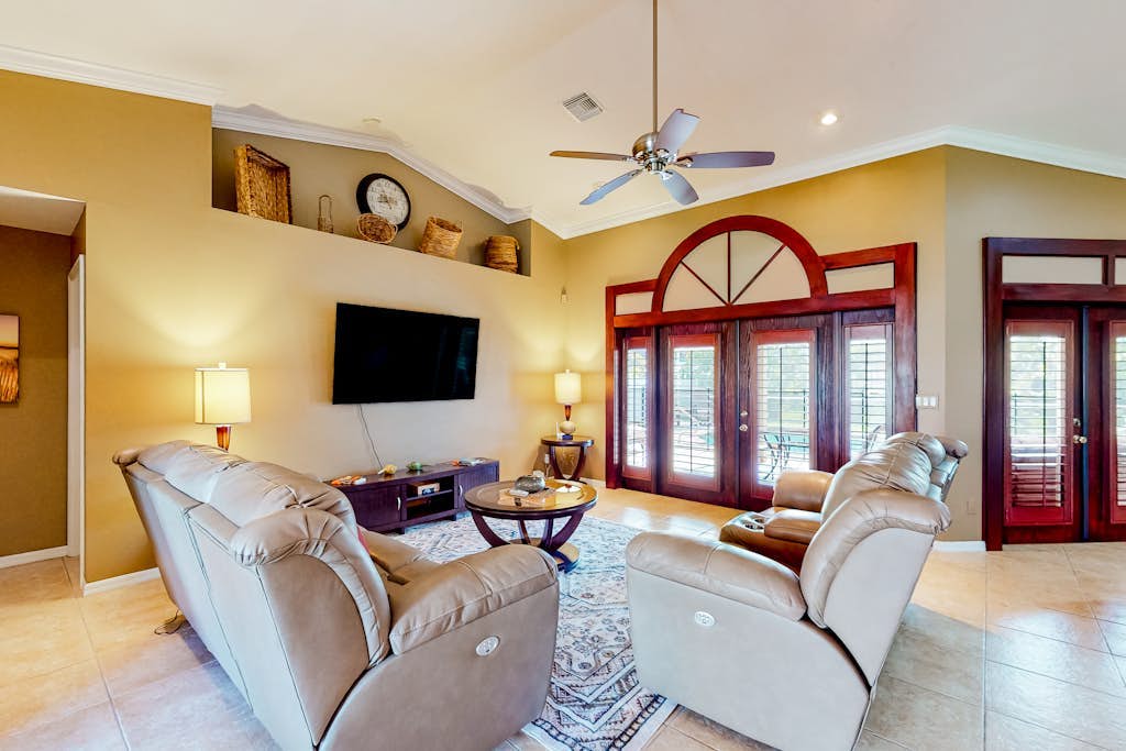 Inviting home with pool, water view, enclosed yard, central AC, W/D