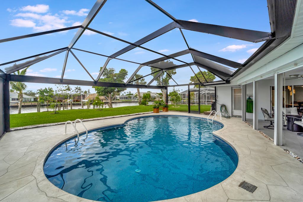 Dog-friendly water-view house with pool & firepit - snowbirds welcome