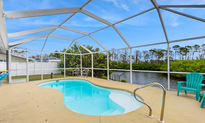 Waterfront & ground-floor home with free WiFi, dock, pool, & central AC