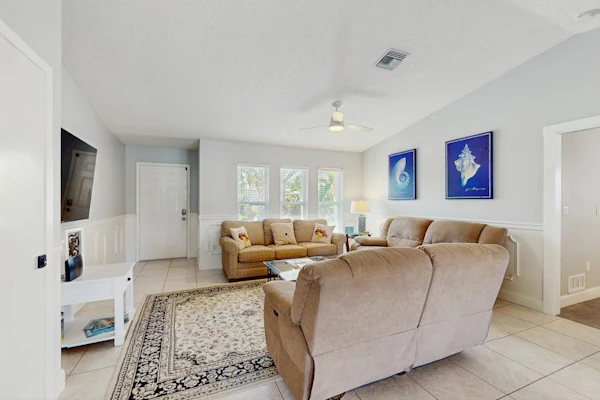 Snowbird-friendly home with private pool, water views, patio & sunroom
