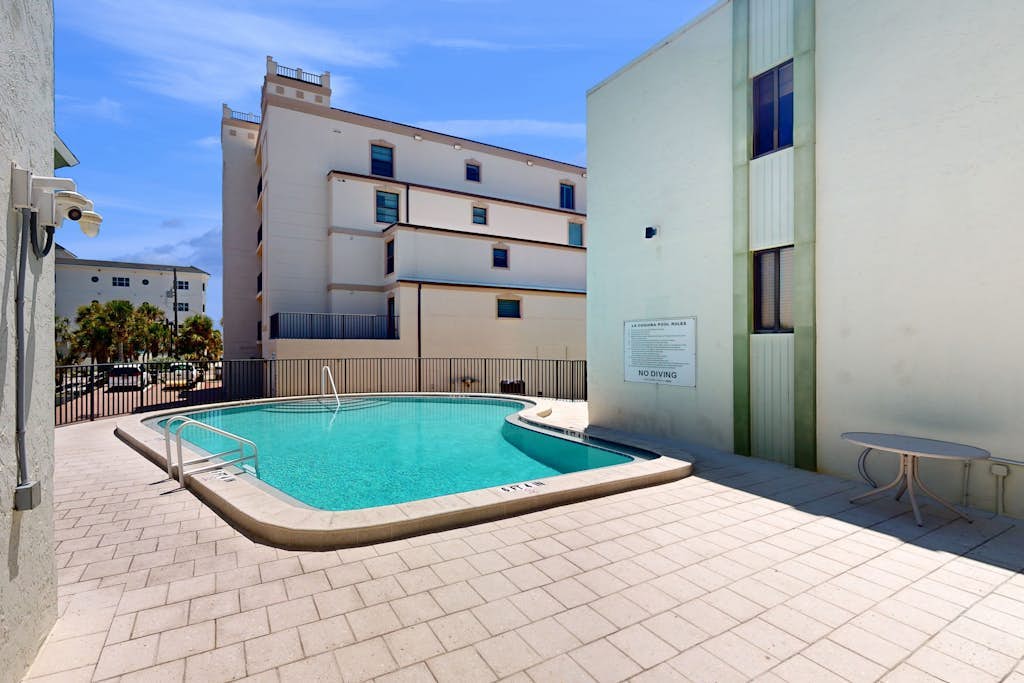 Beachfront condo with pool, private balcony, and washer and dryer