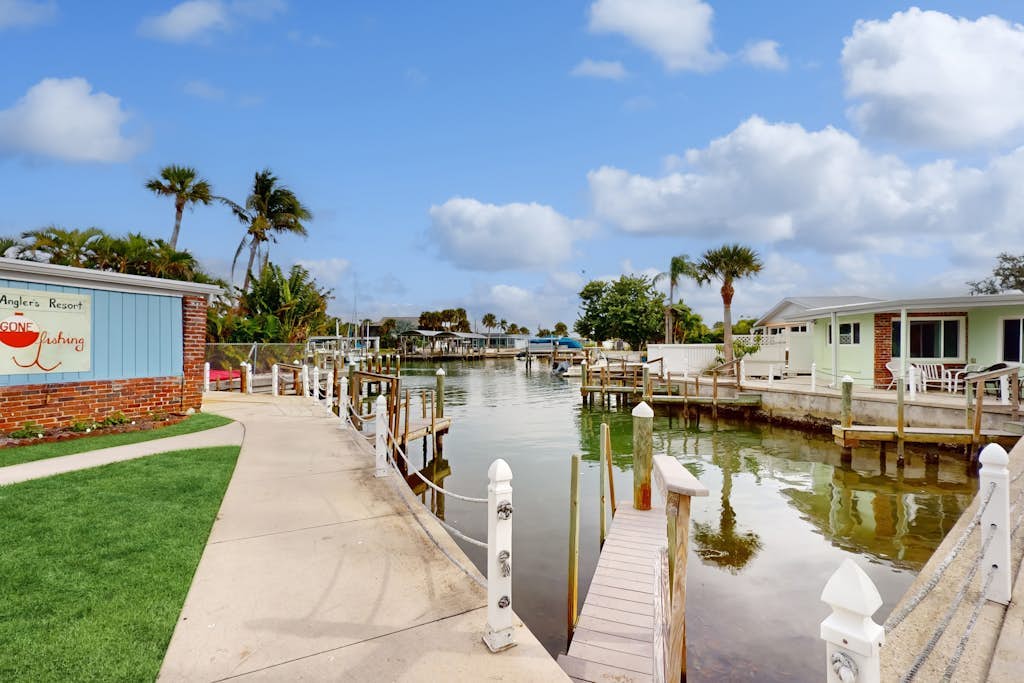 Canal-front condo with private docks, heated pool, private beach access, BBQ