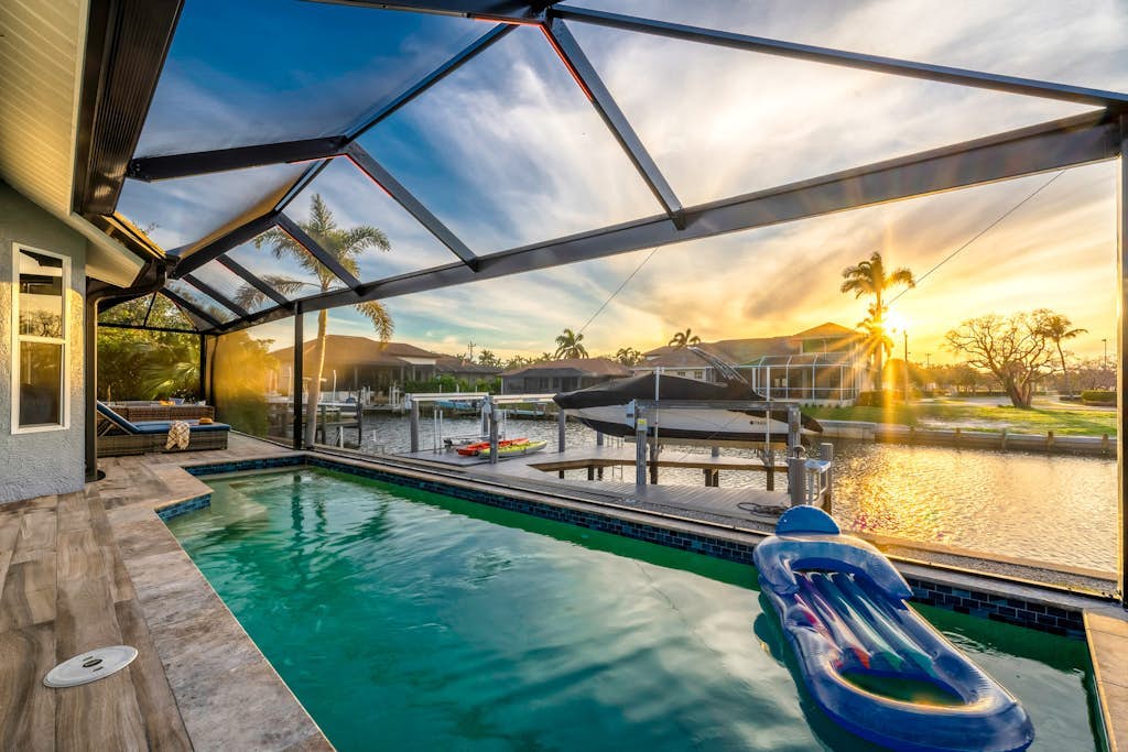 Waterfront house with private pool, dock, bikes, firepit, kayak & lanai