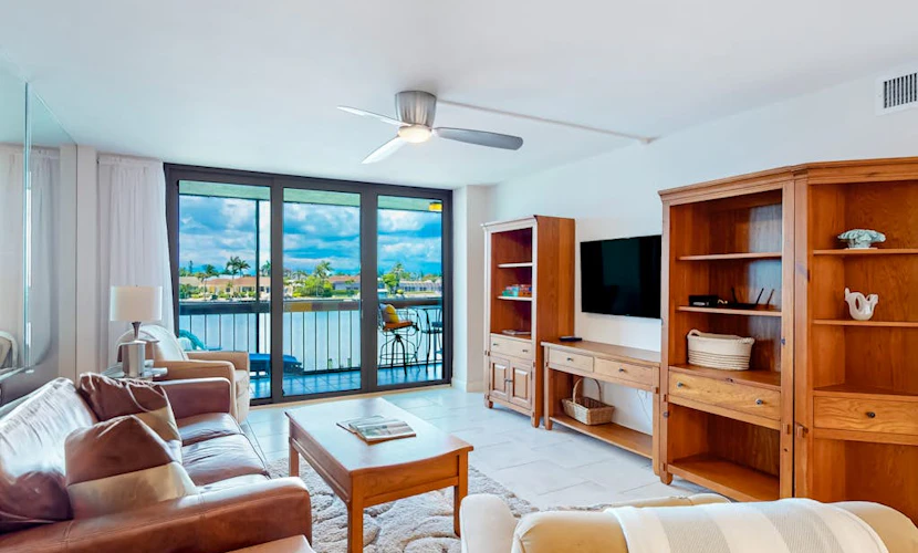 Waterfront condo with bay views, pool, tennis, pickleball, beach, & dock access