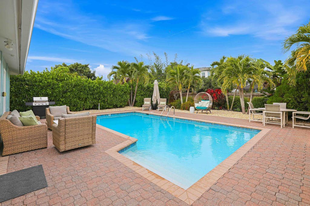 Private heated-or-cooled pool, lush backyard, open-concept, upscale interiors