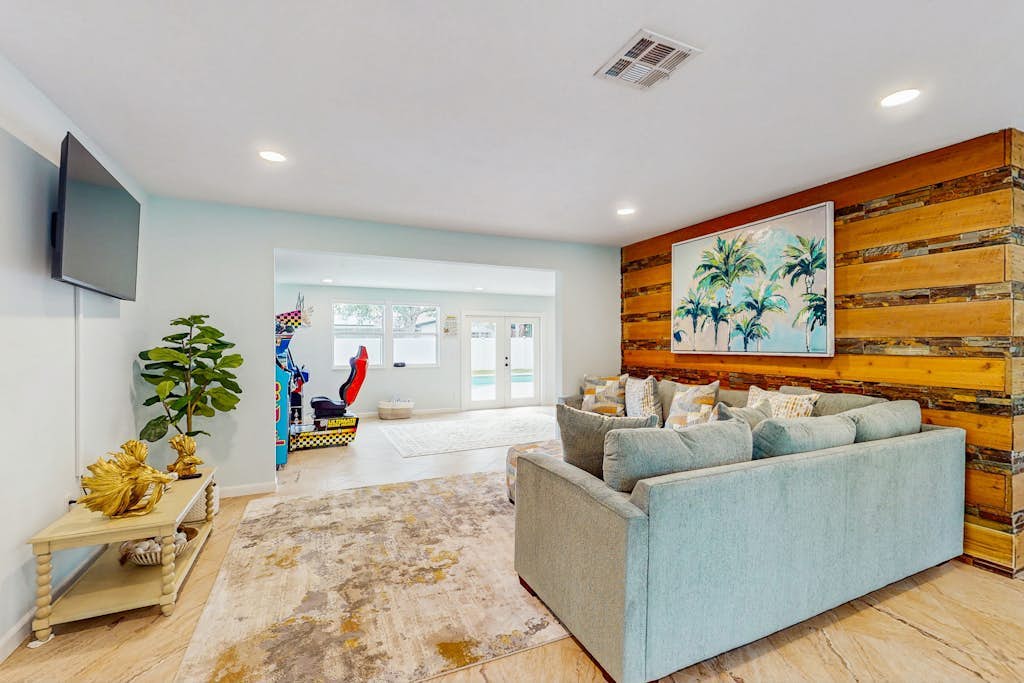 Coastal home with private pool, arcade games, and firepit