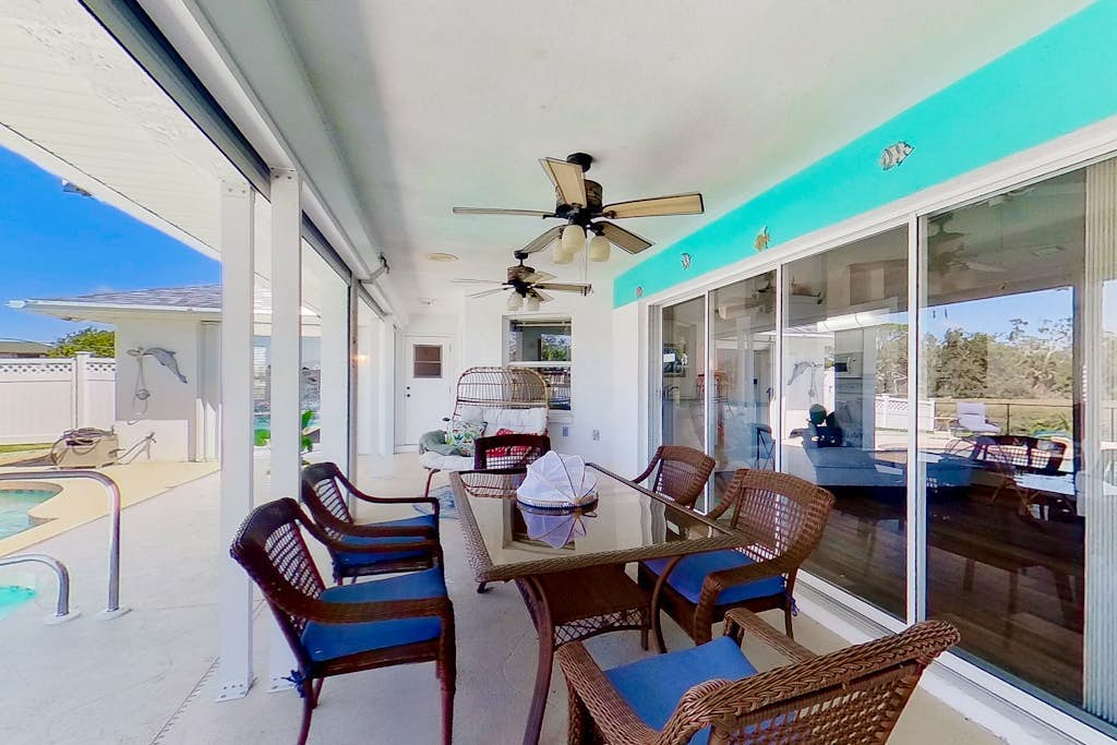 Bohemian canal-front retreat with pool, beach gear, adult bikes, & AC - dogs ok
