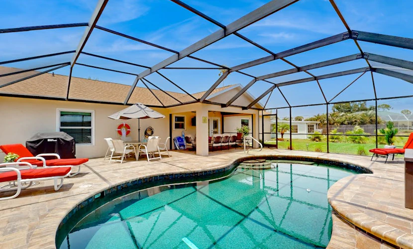 Inviting home w/ screened pool, lovely patio & upgraded interior - beach nearby