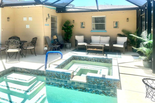 Outdoor paradise on waterway with pool and spa, beach gear, and dog friendly