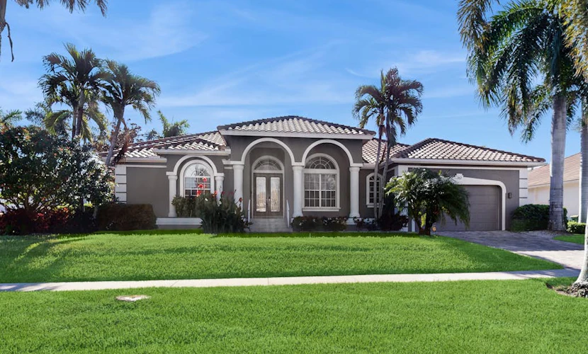 Waterfront home with saltwater pool, pool spa, central AC, W/D, & office space