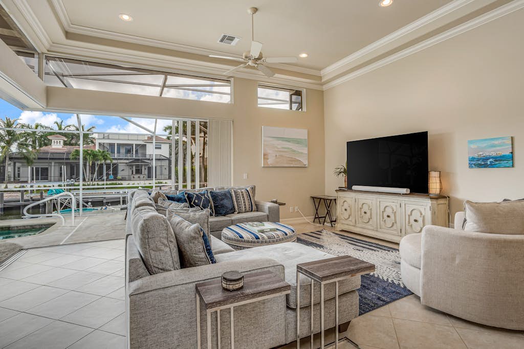Waterfront home with saltwater pool, pool spa, central AC, W/D, & office space