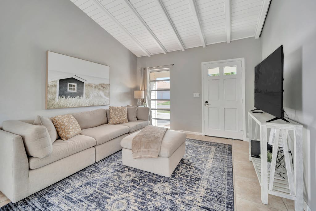 Updated tropical home with a private patio, beach gear, AC, and washer/dryer