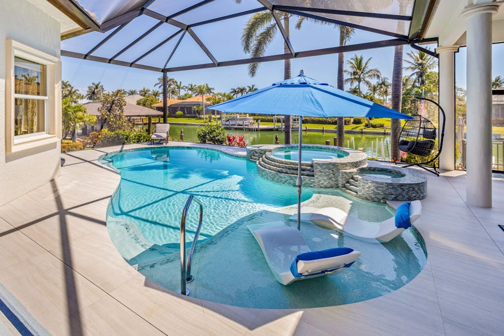 Luxe home near the water with private heated pool, pool spa, grill, firepit, AC