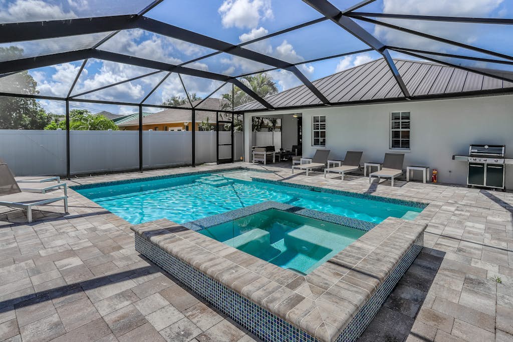 Renovated snowbird-friendly home with private heated pool, pool spa, gas grill