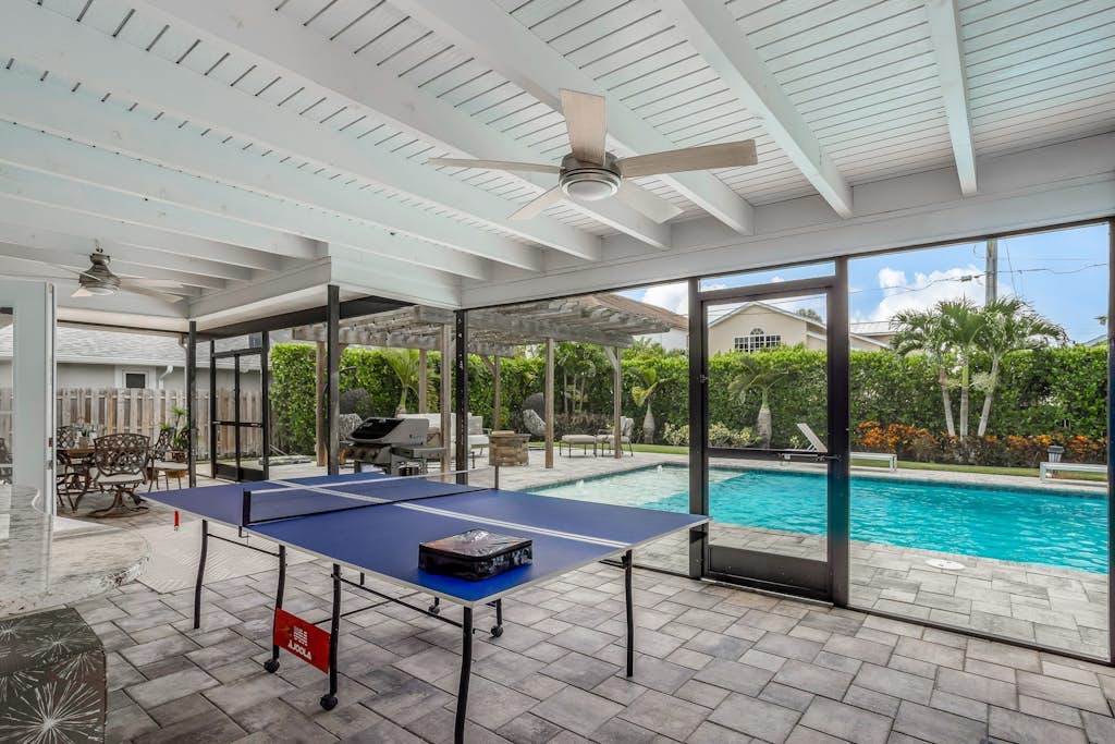 Inviting retreat with a large yard, heated pool, firepit, games & modern charm