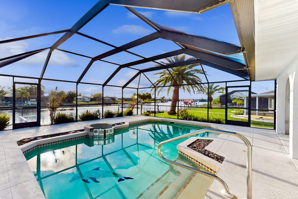 Snowbird Friendly Waterfront Escape with Private Pool, Dock & Serene Canal Views