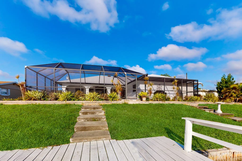 Snowbird Friendly Waterfront Escape with Private Pool, Dock & Serene Canal Views