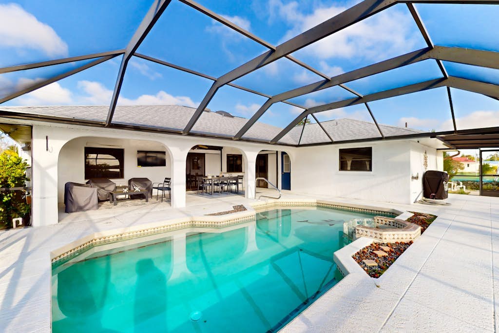Snowbird Friendly Waterfront Escape with Private Pool, Dock & Serene Canal Views