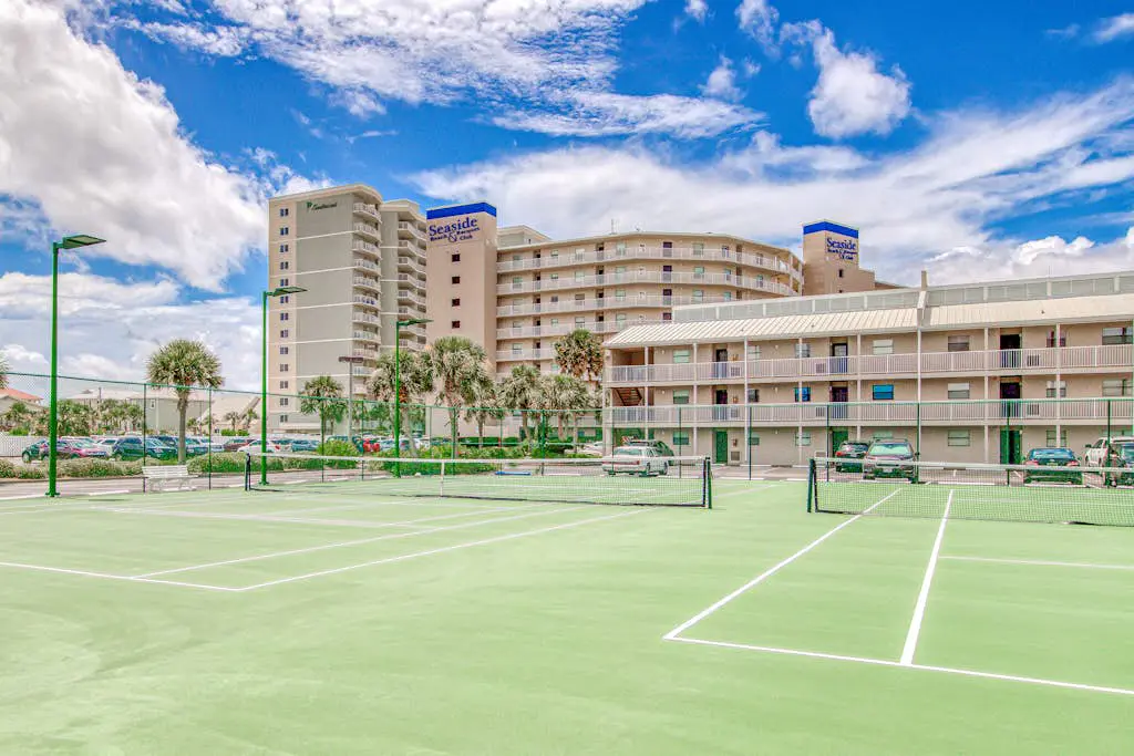 Gulf-view condo with central AC, WiFi, laundry, pools, gym & tennis