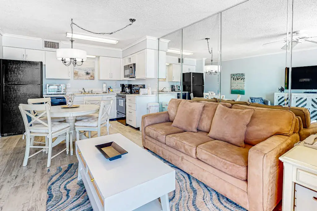Gulf-view condo with central AC, WiFi, laundry, pools, gym & tennis