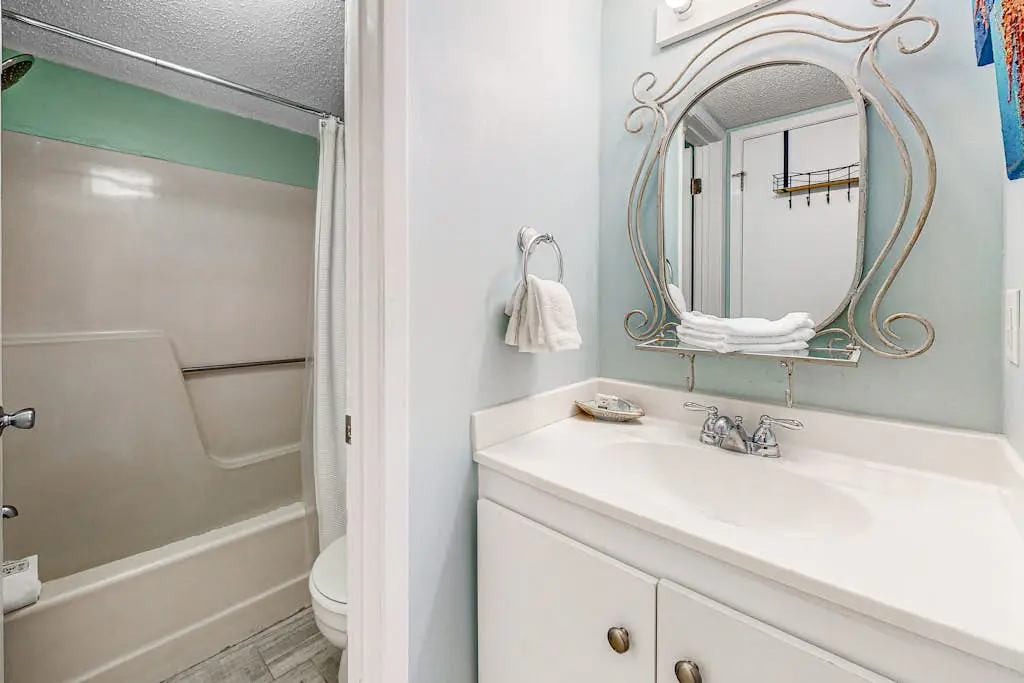 Gulf-view condo with central AC, WiFi, laundry, pools, gym & tennis