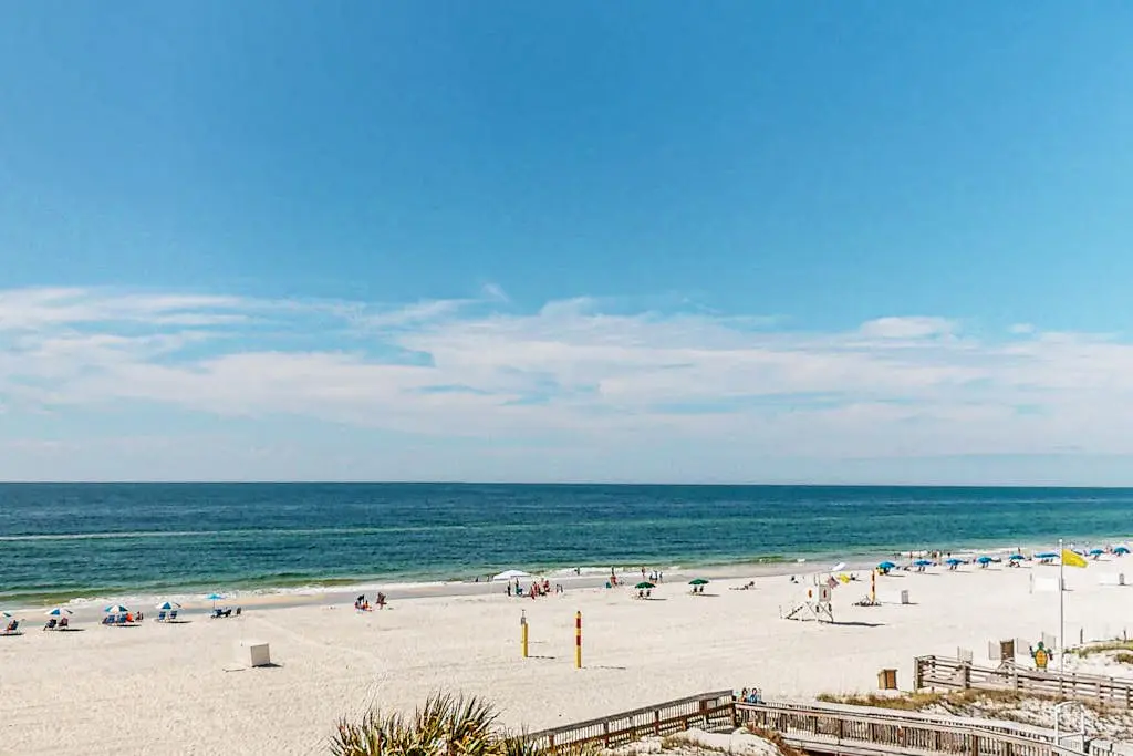 Gulf-view condo with central AC, WiFi, laundry, pools, gym & tennis