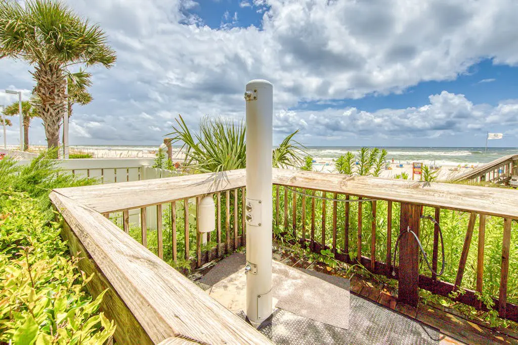 Gulf-view condo with central AC, WiFi, laundry, pools, gym & tennis