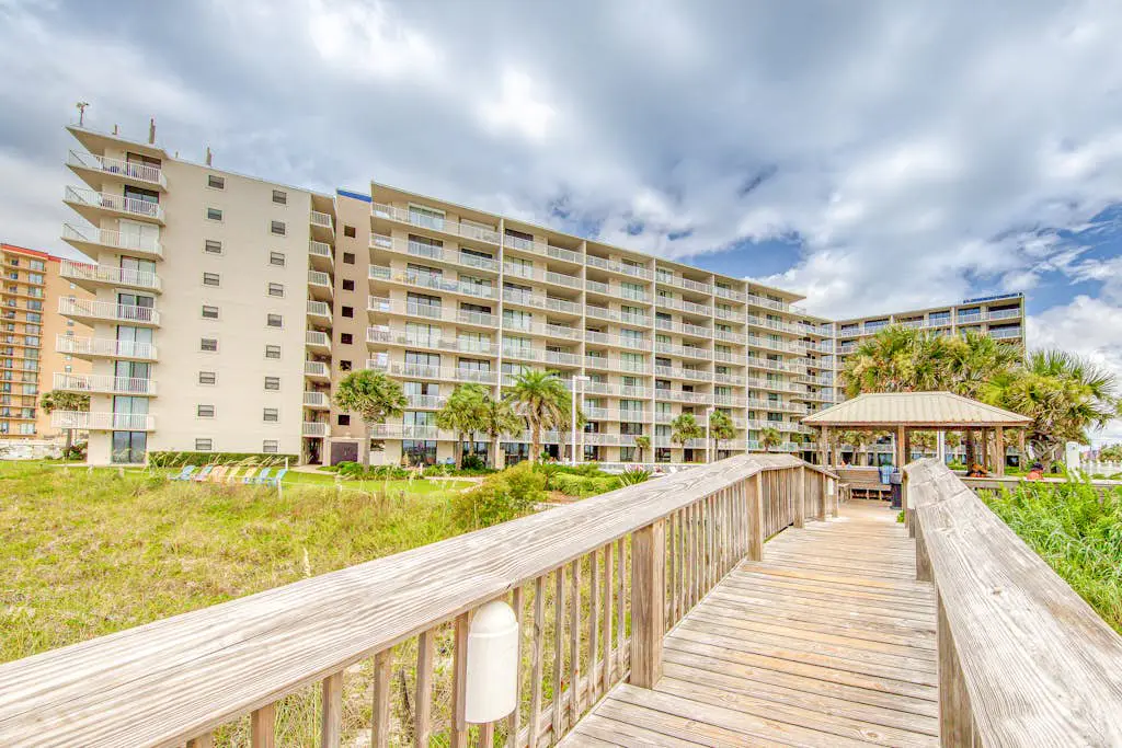 Gulf-view condo with central AC, WiFi, laundry, pools, gym & tennis