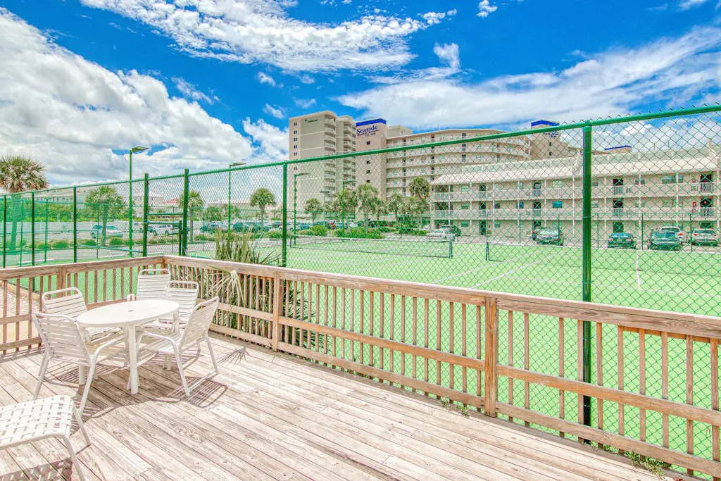 Gulf-view condo with central AC, WiFi, laundry, pools, gym & tennis