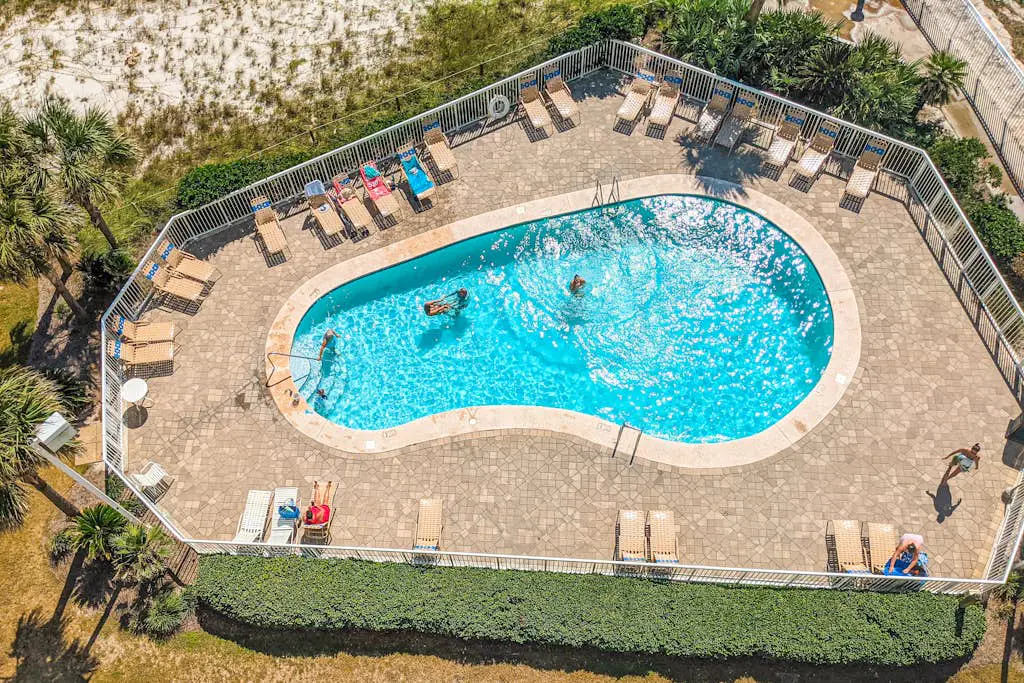 Gulf-view condo with central AC, WiFi, laundry, pools, gym & tennis