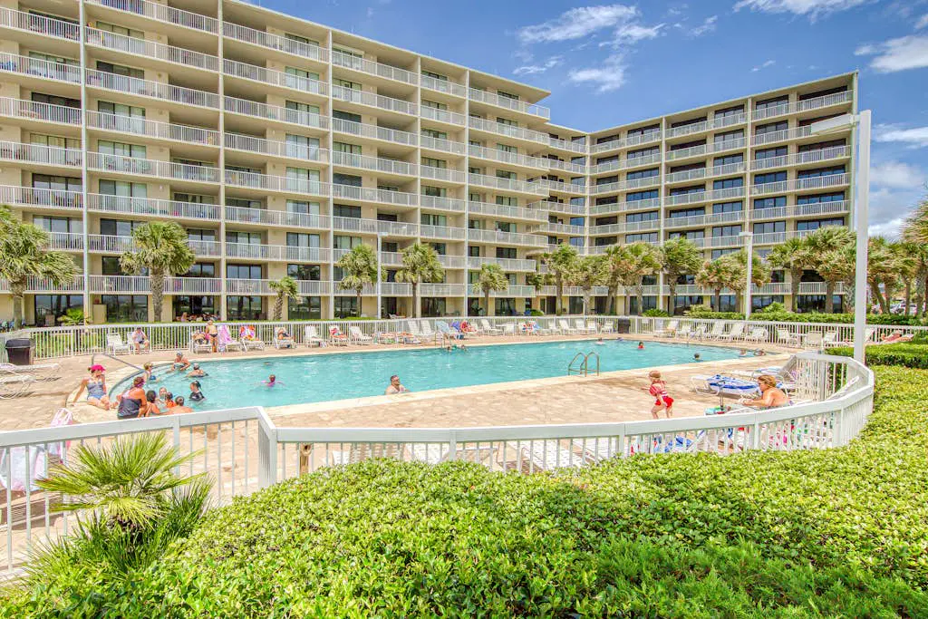 Gulf-view condo with central AC, WiFi, laundry, pools, gym & tennis