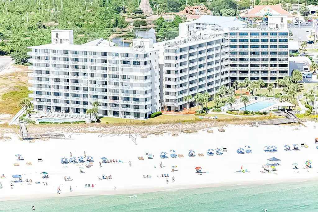 Gulf-view condo with central AC, WiFi, laundry, pools, gym & tennis