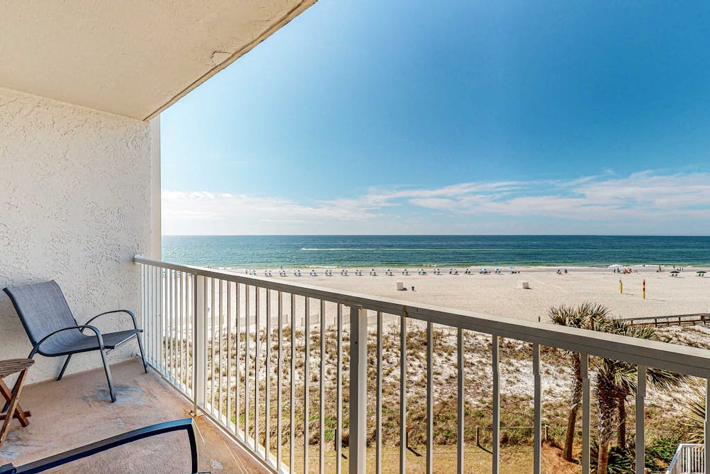 Gulf-view condo with central AC, WiFi, laundry, pools, gym & tennis