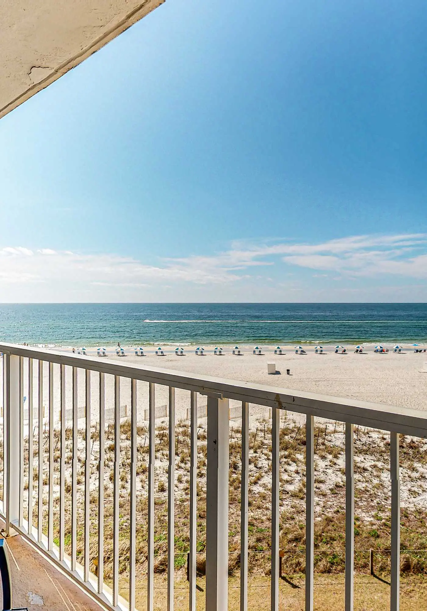 Gulf-view condo with central AC, WiFi, laundry, pools, gym & tennis