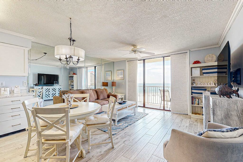 Gulf-view condo with central AC, WiFi, laundry, pools, gym & tennis