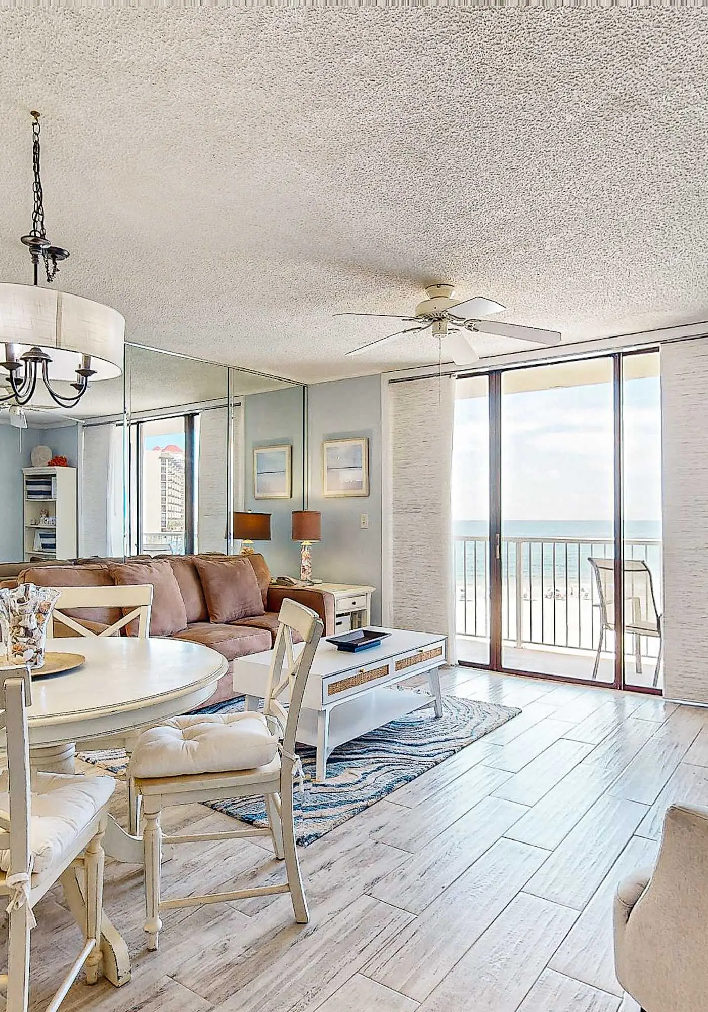 Gulf-view condo with central AC, WiFi, laundry, pools, gym & tennis