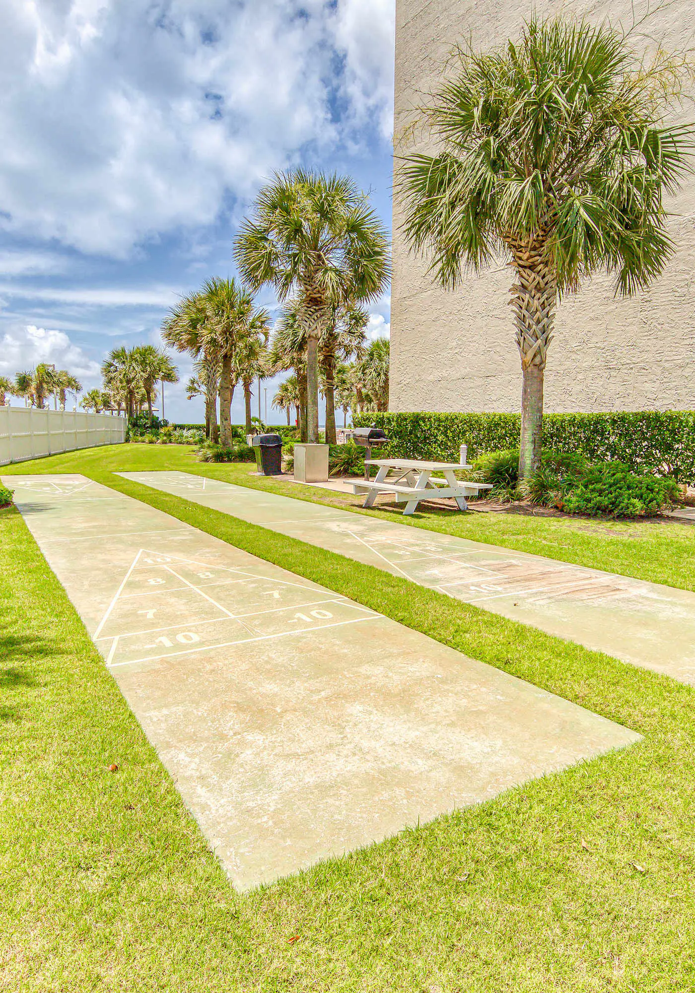Gulf-view condo with central AC, WiFi, laundry, pools, gym & tennis
