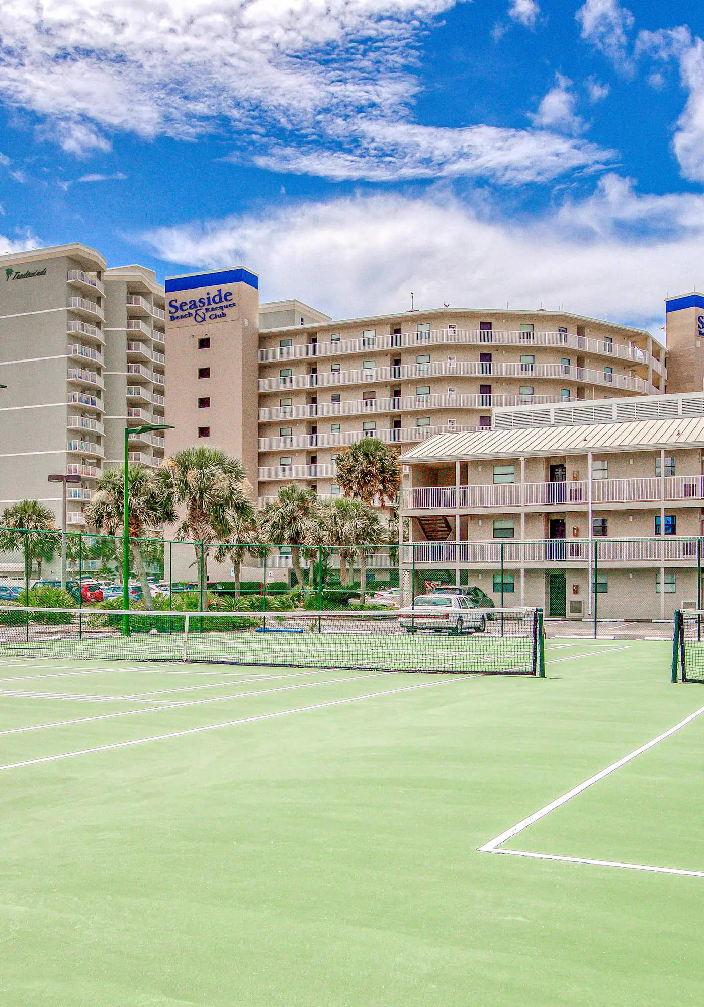 Gulf-view condo with central AC, WiFi, laundry, pools, gym & tennis
